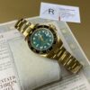 Rolex GMT Master II Gold & Green Dial